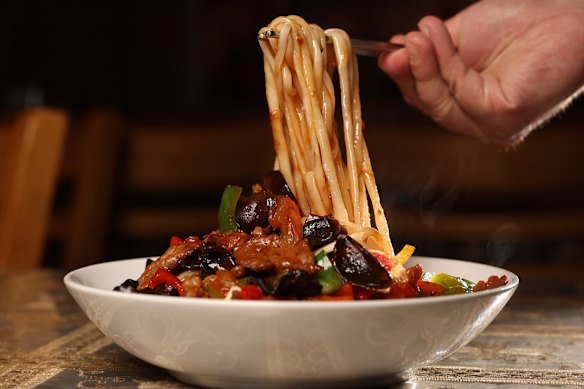 The signature lagmen stir fry with bouncy hand-pulled noodles.