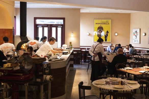 A pizza oven dominates the dining room at Puttanesca.