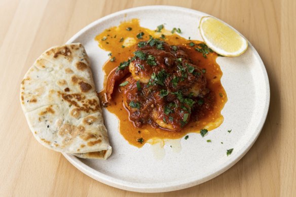 Prawns with green capsicum, tomato, caraway and flatbread.