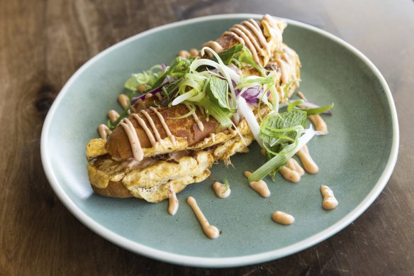 Roti John tiger roll filled with lamb shoulder and omelette.