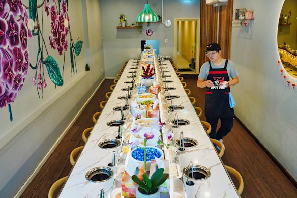 Each diner gets their own hot pot station and tongs at Divine Hotpot.