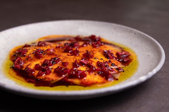 House-made ricotta with persimmon and pepperberry.