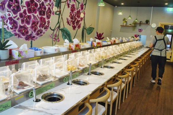 Each diner gets their own hot pot station and tongs.
