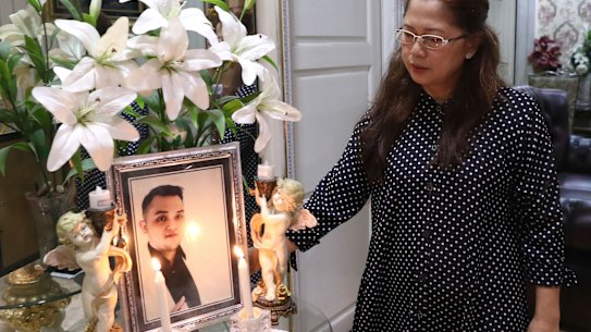Herlina Simbala looks at a portrait of her son, Dr Michael Robert Marampe during an online memorial service to mark the 40th day since he passed away due to COVID-19 in Jakarta. Dr Marampe knew what he wanted to be since he was a kid: a doctor and a pianist. He became both.