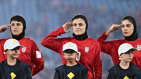 Members of the Iran women's football team sing the national anthem during the AFC Women's Asian Cup Australia match against the Philippines on the Gold Coast on March 8.