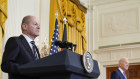 US President Joe Biden and German Chancellor Olaf Scholz listen to a question from a reporter during a news conference in the East Room of the White House, Monday in Washington.