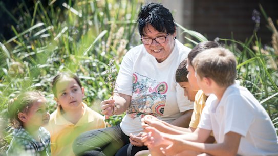 Local Aboriginal elder Aunty Maxine teaches her students about bush food at Chifley PS in Malabar