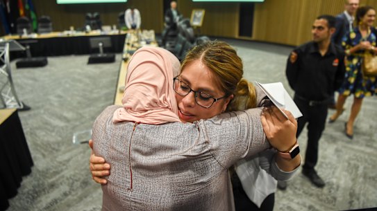 The last meeting of Casey council after it was sacked last month. Mayor Susan Serey embraces members of the public.