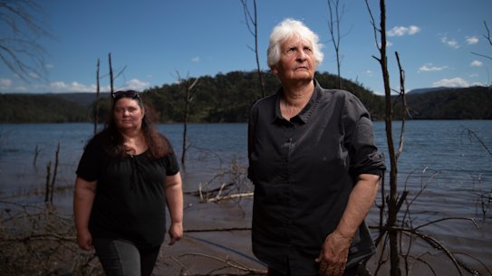 Traditional owners Sharyn Halls (right) and Kazan Brown stand beside Lake Burragorang.