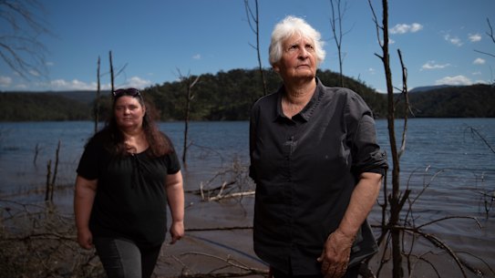 Traditional owners Aunty Sharyn Halls (right) with Kazan Brown stand beside Lake Burragorang in Sydney's Special Areas. The lake's levels will rise as much as 17 metres if the Warragamba Dam wall is lifted to curb downstream flood risks.