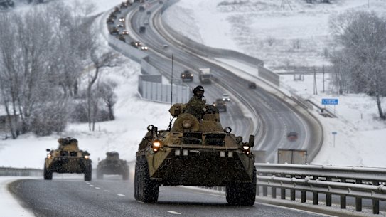 A convoy of Russian armoured vehicles moves along a highway in Crimea on January 18. 