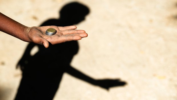 Giving money to child beggars in the developing world perpetuates a cruel system.