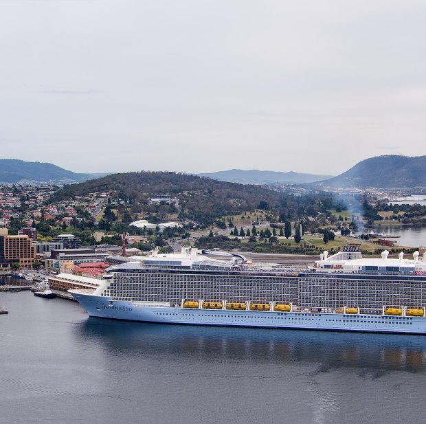 The cruise ship Ovation of the Seas arrives in Hobart in 2016; such tourist-filled vessels are a boon for Tasmania’s economy.