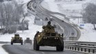 A convoy of Russian armored vehicles moves along a highway in Crimea this month. 