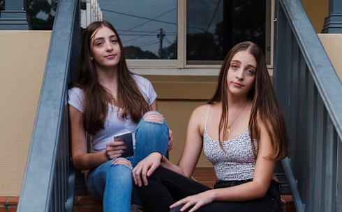 Twins Madelyn (blue jeans) and Lara, with mum Sonia Tecli at their home in Gladesville. 