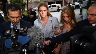 Australian swimmer Shayna Jack (centre) is seen arriving for a briefing with ASADA in Brisbane on Friday.