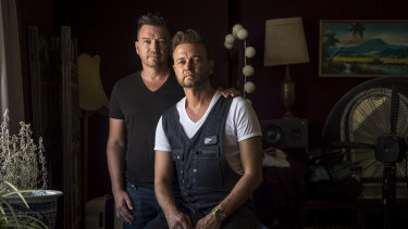 Brad Harker, right, a Mormon man who came out at 40 after a lifetime of being shamed by his church, and with his husband, Scott.

