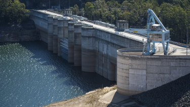 Warragamba Dam, now sitting at about 50 per cent full. The government says lifting the wall by 14m would reduce downstream flood damage.