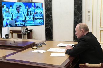 Russian President Vladimir Putin speaks with the Russian Paralympic Committee last month.