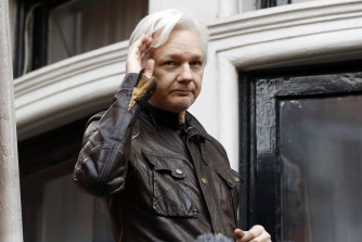 WikiLeaks founder Julian Assange greets supporters from a balcony of the Ecuadorian embassy in London 2017.