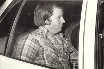 Douglas Kay Morgan aka the After Dark Bandit, being taken to Russell Street police headquarters in 1979.
