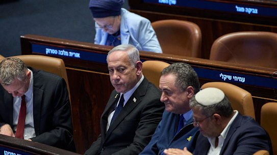 Israel’s Prime Minister Benjamin Netanyahu, surrounded by ministers from the government attends a session of the Knesset – Israel’s parliament – in Jerusalem, on Monday.