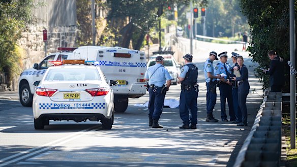Police on the street in Forest Lodge where Mr McKee died.
