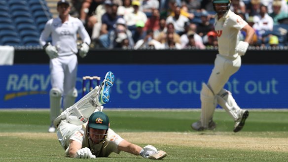Cameron Green slides on the ground as he unsuccessfully tries to avoid being run out in the first innings.