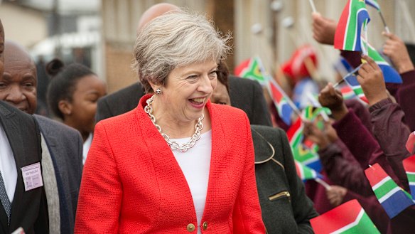 British Prime Minister Theresa May pictured in South Africa last week when trying to sell new trade deals with the UK.