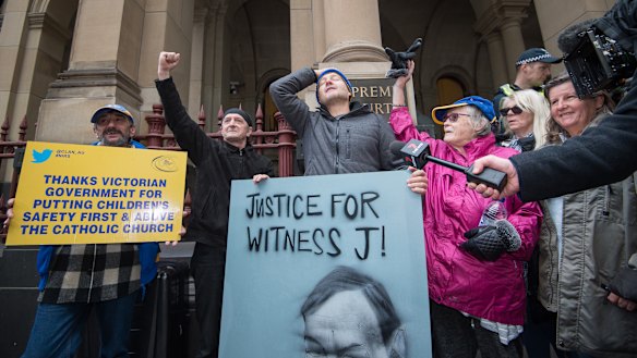 Protesters and supporters of abuse survivors outside Melbourne's Supreme Court building on Wednesday.