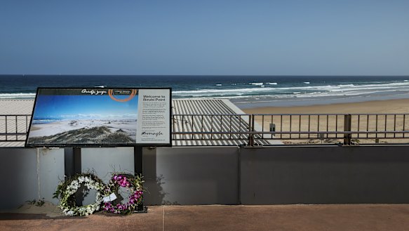 Floral tributes laid at Birubi.