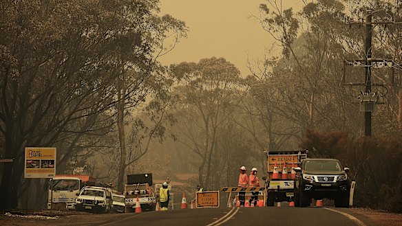 A police road block on Wilson Road between Buxton and Balmoral. The road has been closed due to the Green Wattle Creek fire.