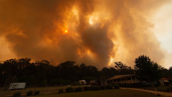  The Liberation Trail fire outside Nana Glen becomes visible after low lying smoke clears this week.  
