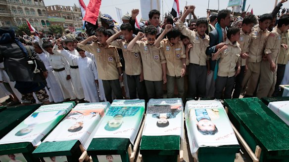Yemeni people attending the funeral of victims of a Saudi-led airstrike in August.