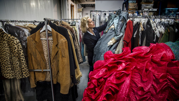 Charlotte Smith in the storage unit that houses her vast fashion collection. She hopes her sales will cut it down to half its present amount.