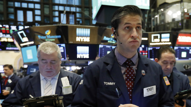 Wall Street slid lower despite upbeat economic news. 