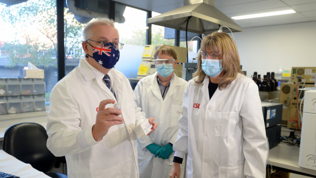 Prime Minister Scott Morrison meets CSL staff working on the COVID-19 vaccine at a facility in Melbourne on Friday.