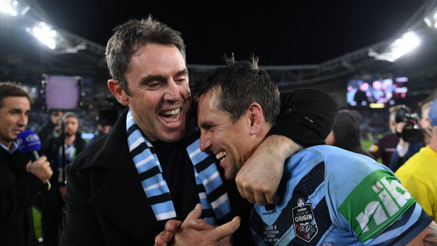 We did it: NSW coach Brad Fittler congratulates his halfback Mitchell Pearce after game three.