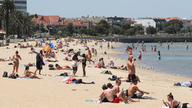 Crowds cooled off at St Kilda beach.