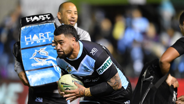 Fired up: Andrew Fifita warms up for Saturday's game while assistant coach Jim Dymock looks on.