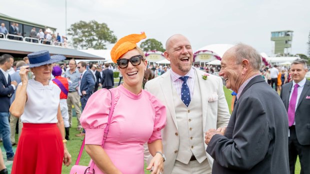 Zara and Mike Tindall share a laugh with Gerry Harvey at the Magic Millions raceday on Saturday. 