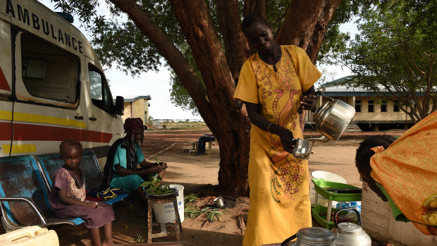 A woman prepares coffee at her stand at the Bentiu hospital in Bentiu, Unity State, South Sudan. 