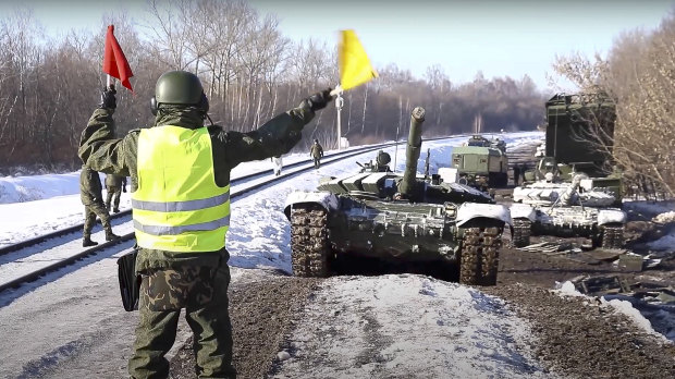 Truth or lies? The Russian Defence Ministry Press Service released images and a video showing what it said were army tanks being loaded up for transportation back to their base after drills. 