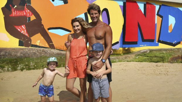 Bondi Rescue lifeguard Anthony 'Harries' Carroll with wife Emily and sons Billy and Leo. 