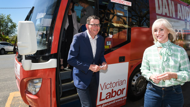 Daniel Andrews gets off the campaign bus with his wife Cath.