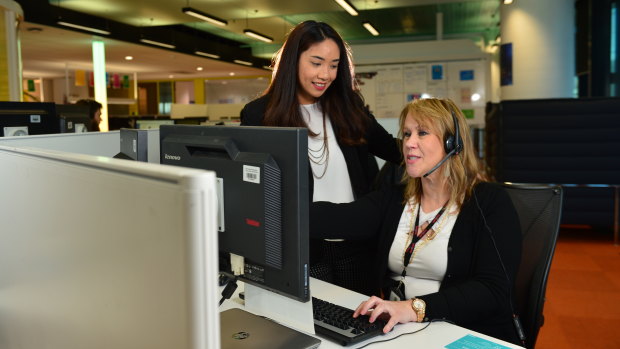 Medibank nurse Jonna Marisse Nayan (left) and consultant Janine Dunn at a Medibank customer support centre.