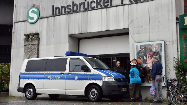 A police car blocks the entrance of the city train station Inssbrucker Platz in Berlin, Germany.