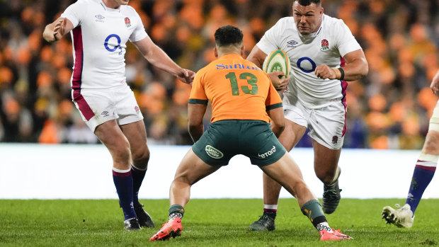 Bent at the knees: Hunter Paisami prepares to make a tackle at the packed SCG.