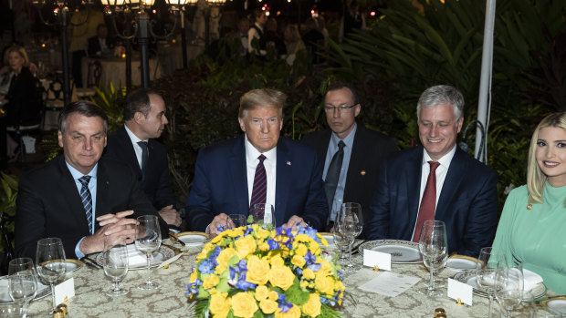 US President Donald Trump at dinner with Brazilian President Jair Bolsonaro, left, National Security Adviser Robert O'Brien, and Ivanka Trump, daughter and assistant to President Donald Trump, at Mar-a-Lago, on March 8.