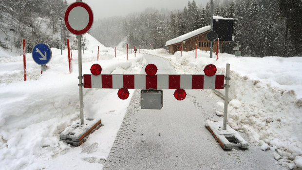 A mountain pass road is closed in Obermaiselstein, Germany on Sunday due to the risk of avalanches.